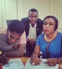 Burna-Boy-his-mother-sign-Glo-deal-600x600