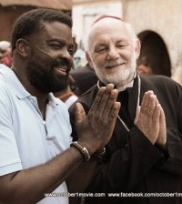 Behind-the-scene-shost-from-October-1-The-Director-Kunle-Afolayan-and-Rev.-Downling-Colin-David-Reese-having-a-last-minute-joke-on-set.-This-was-his-last-scene-before-returning-back-to-Paris.-600x400