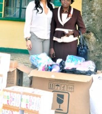 Monalisa presenting some of the items to the Female Prison's Chaplain Mrs. Oladejo